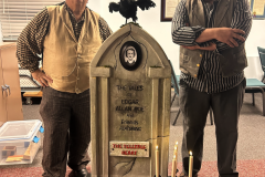 Picture of Dave and Todd MacLean with candelabra and "gravestone" of Edgar Allan Poe for the Magic Lantern presentation of "The Tell-Tale Heart."