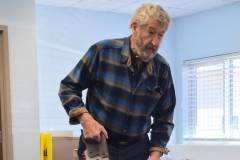 Bob LaMay showcases his custom-named saw